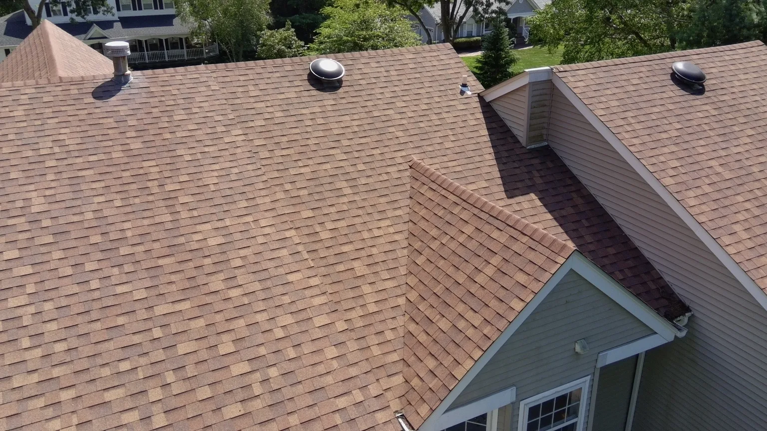 Finished architectural shingle roof with multiple roof planes