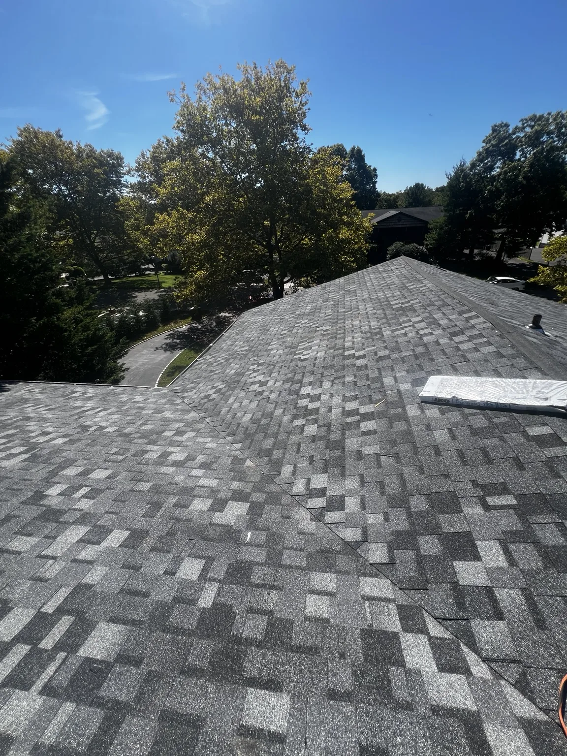 Residential shingle roof installation in progress