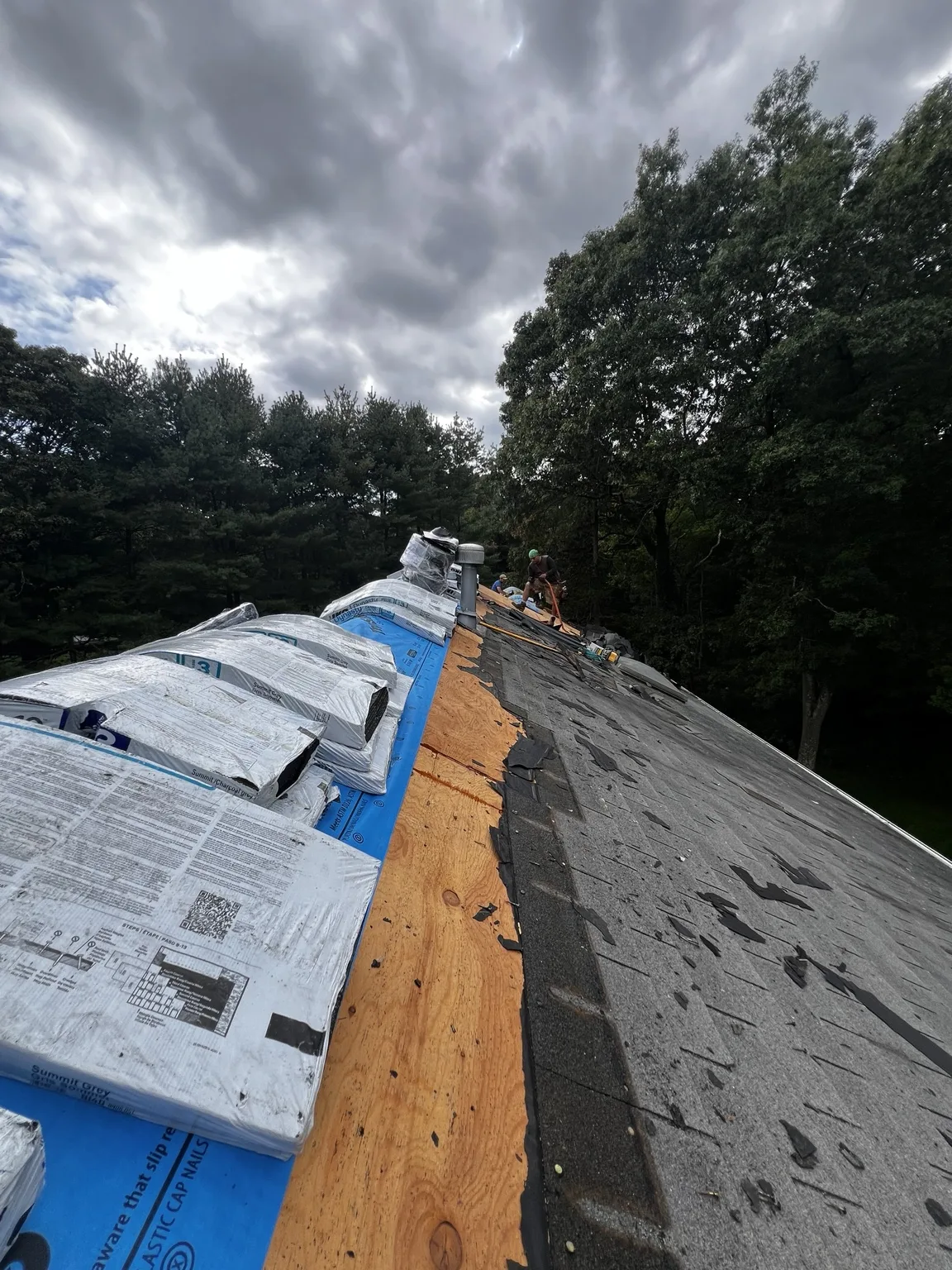 Residential roof tear-off exposing the roof deck